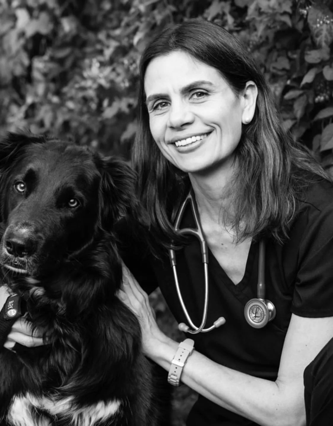 Dr. Emma Bermudez taking a photo with her dog Dr. Emma Bermudez taking a photo with her dog