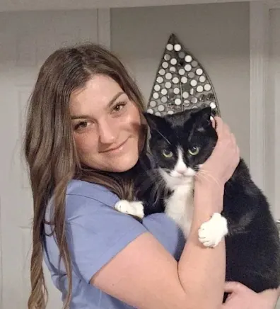 Staff photo of Stacie holding a cat Staff photo of Stacie holding a cat