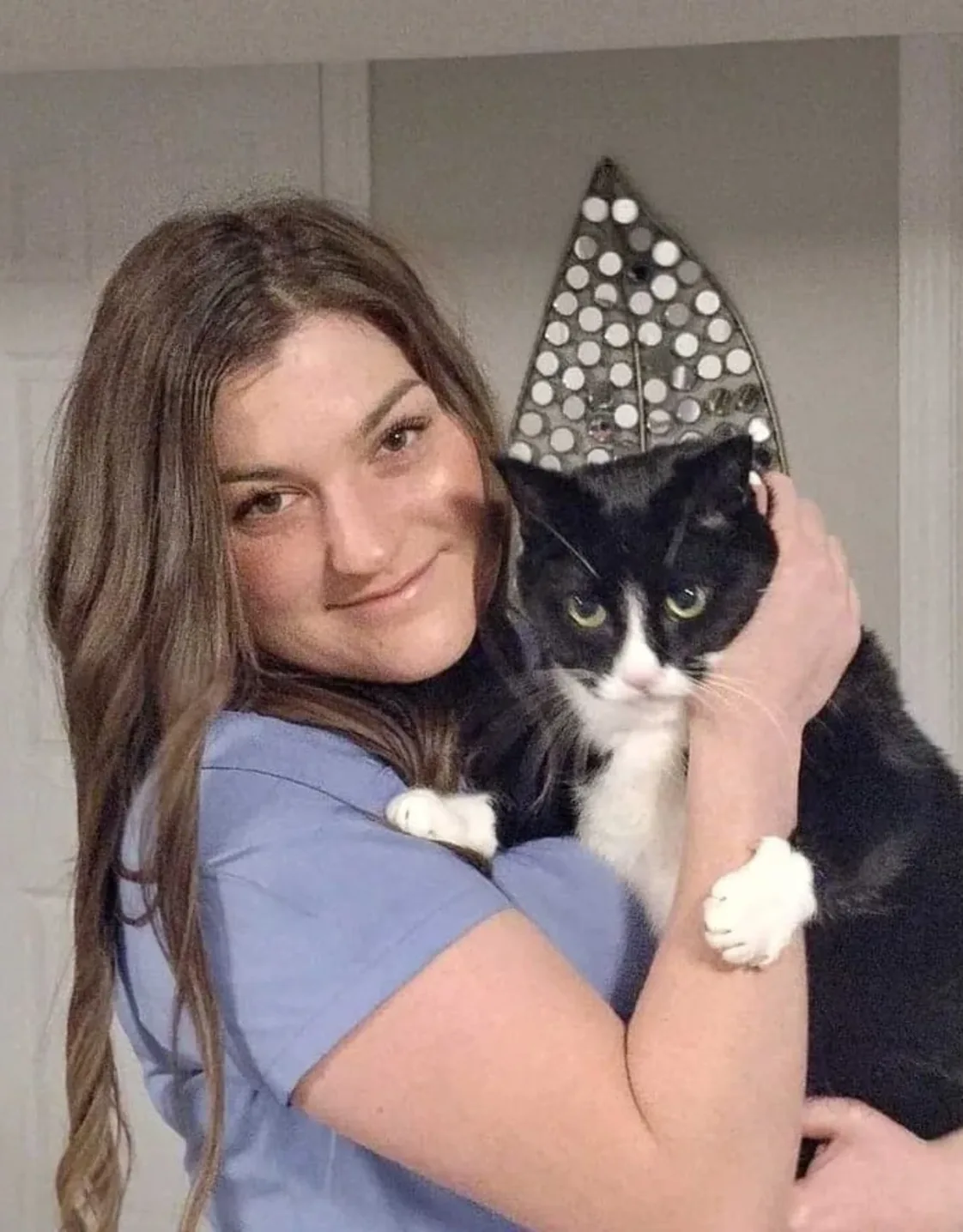 Staff photo of Stacie holding a cat Staff photo of Stacie holding a cat