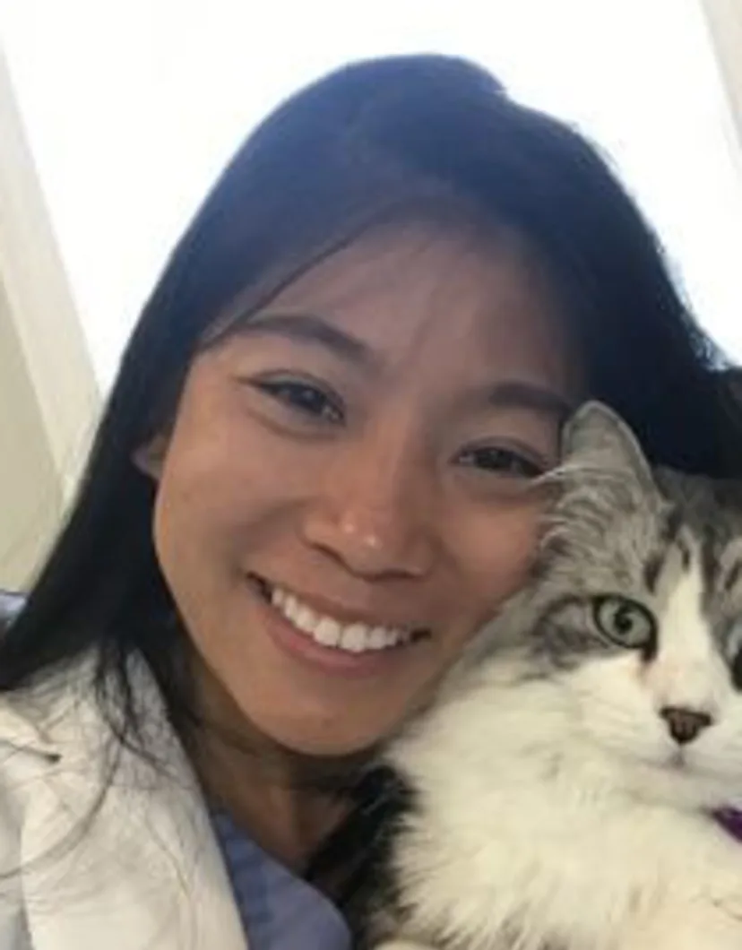 Dr. Jennifer Ma of Veterinary Care Group Little Neck holding a cat