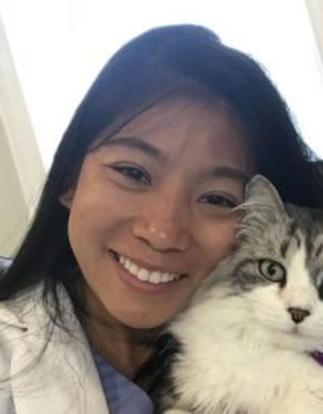 Dr. Jennifer Ma of Veterinary Care Group Little Neck holding a cat Dr. Jennifer Ma of Veterinary Care Group Little Neck holding a cat