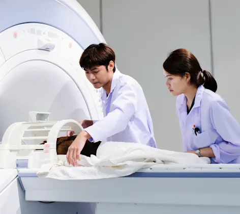 Doctors performing MRI scan on dog Doctors performing MRI scan on dog