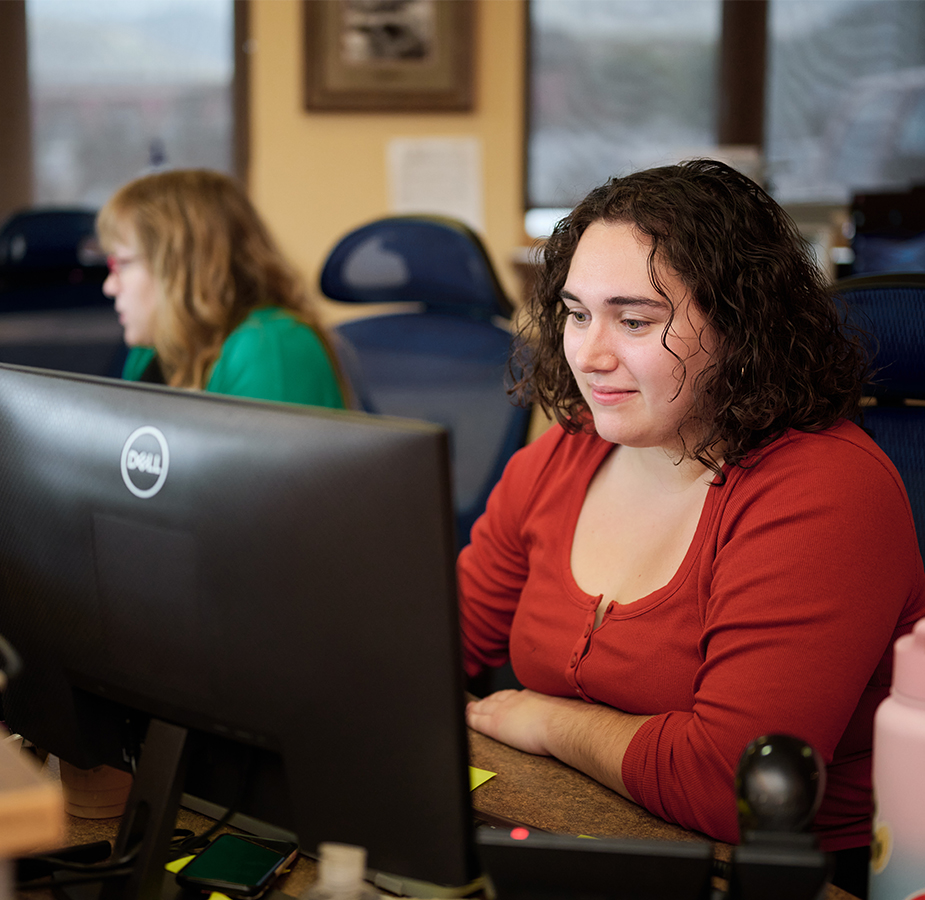 Customer service agents working at a desk