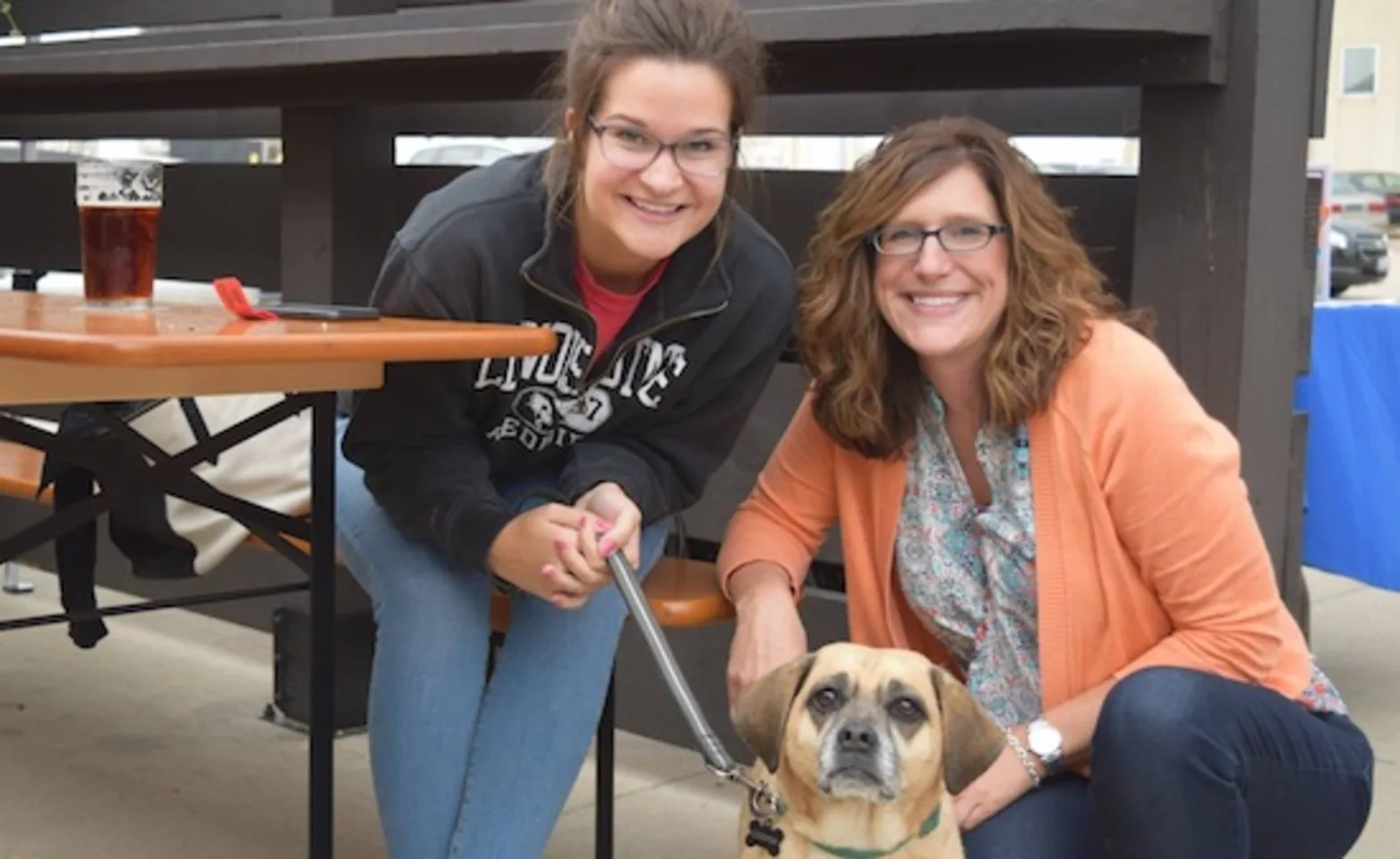 Two owners and their dog Two owners and their dog