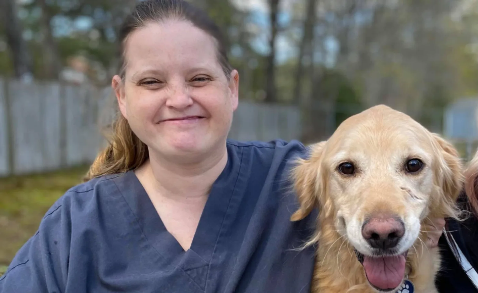 Erin (Staff) with a Golden Retriever (Dog) Erin (Staff) with a Golden Retriever (Dog)