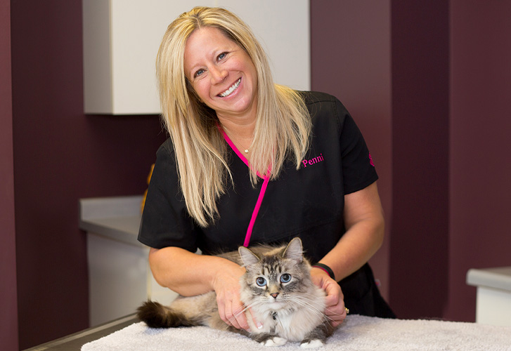 Penni treating cat