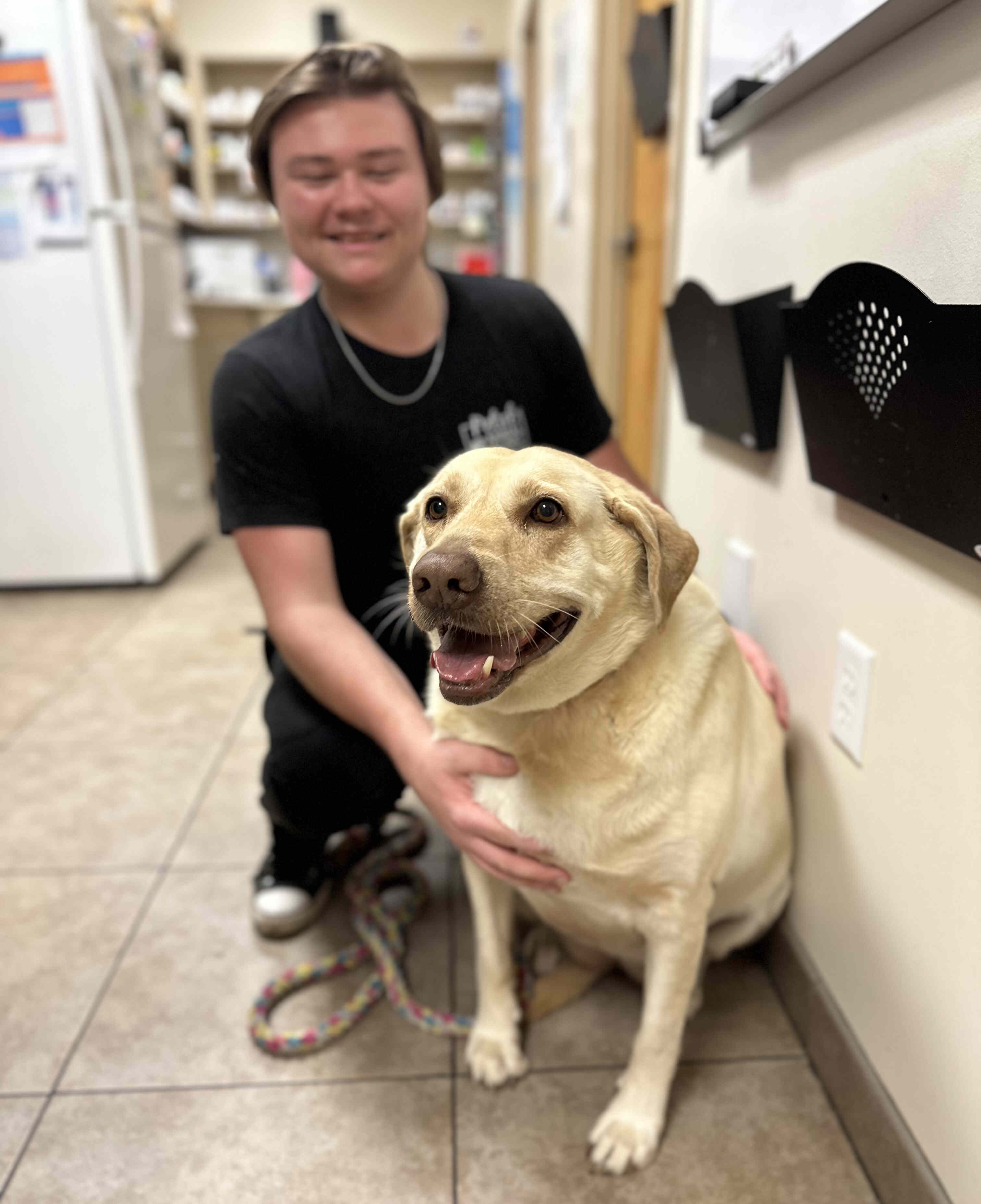 Our Staff with a Smiley Patient (Dog)