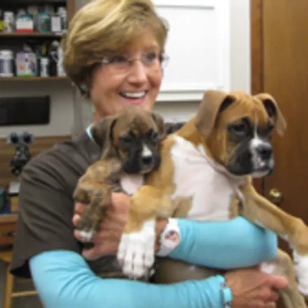 Debbie holding 2 dogs