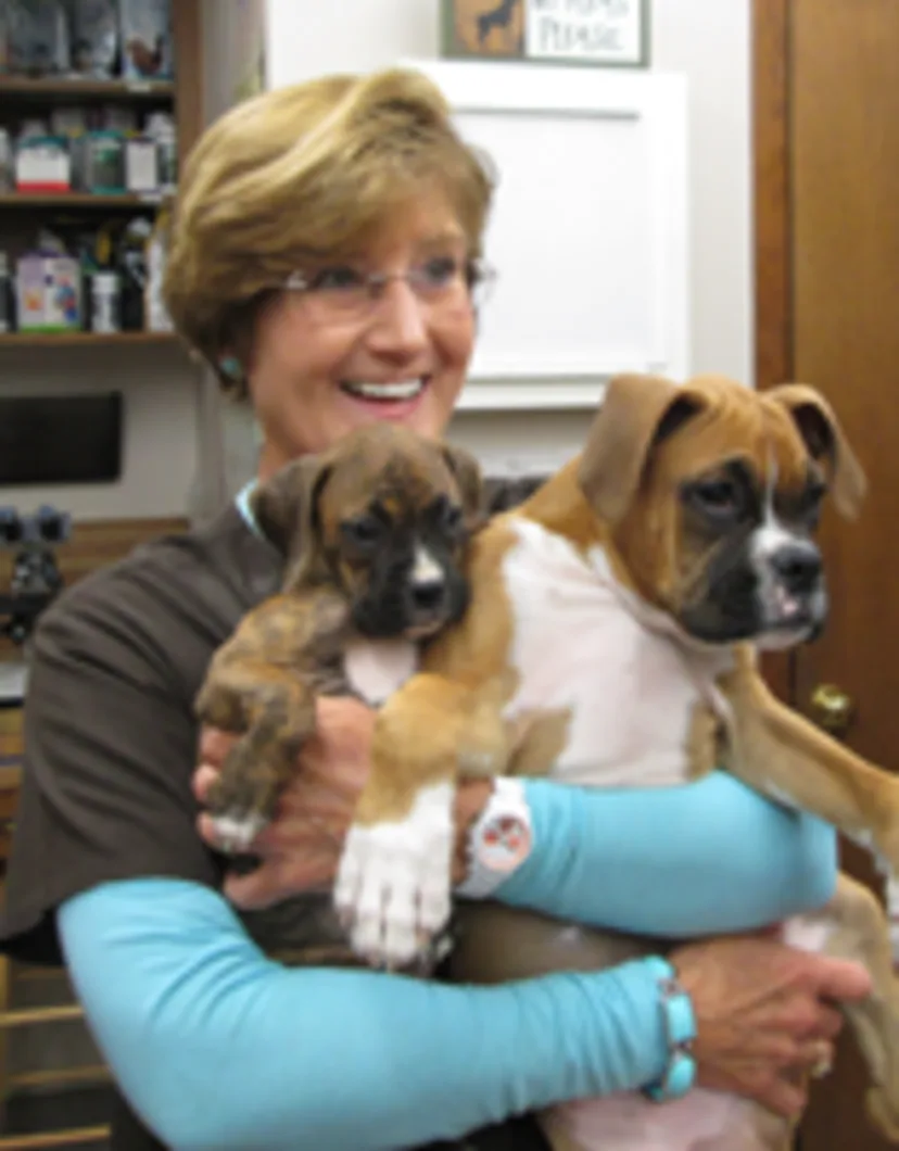 Debbie holding 2 dogs