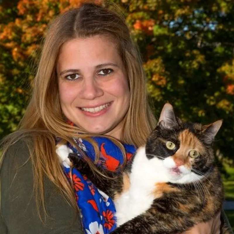 Photo of Dr. Amelia Andersen w/ calico cat Photo of Dr. Amelia Andersen w/ calico cat