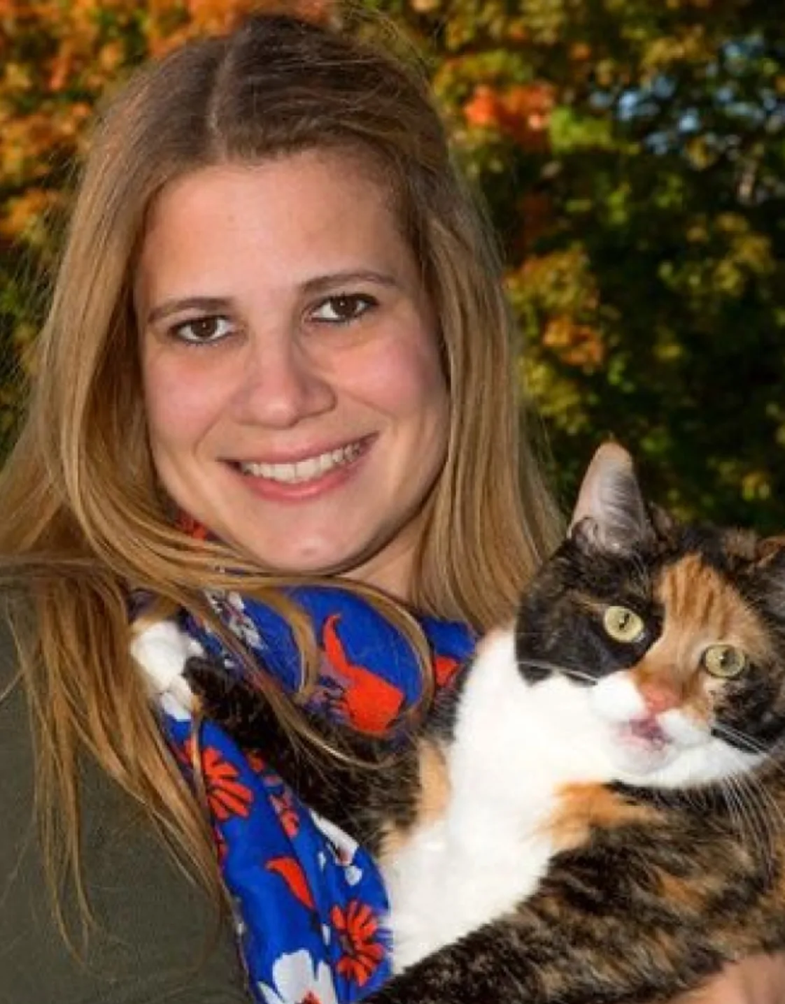 Photo of Dr. Amelia Andersen w/ calico cat Photo of Dr. Amelia Andersen w/ calico cat