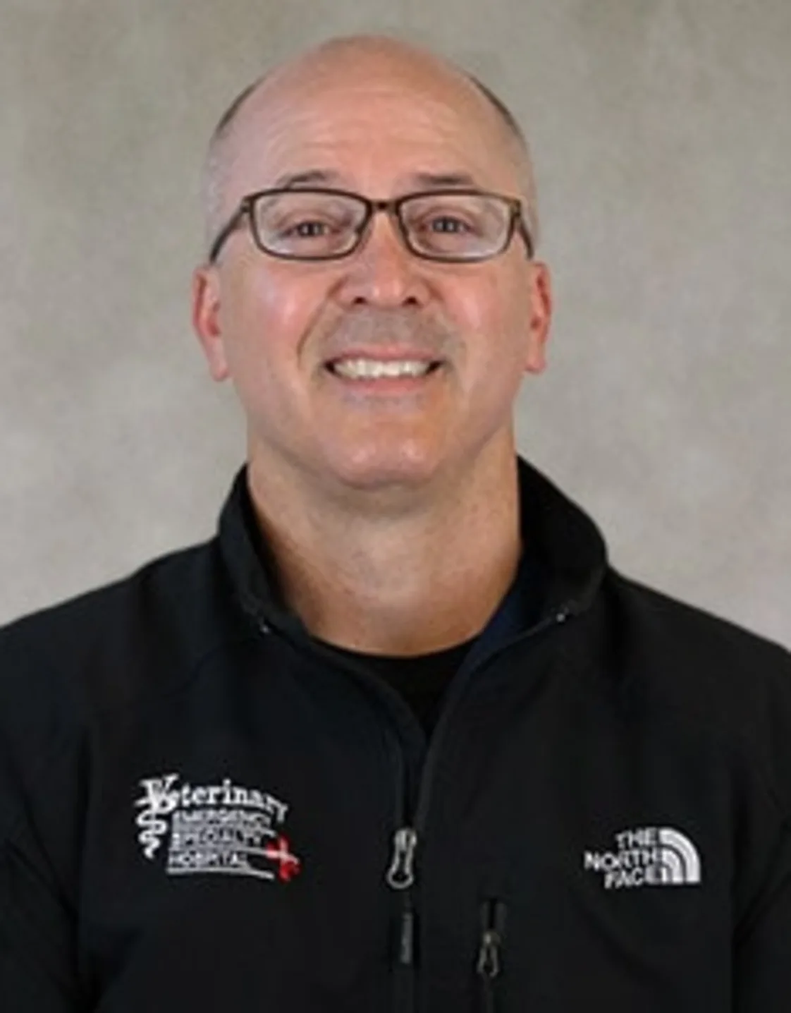 Dr. Mark Schlatter smiling in front of a grey backdrop Dr. Mark Schlatter smiling in front of a grey backdrop