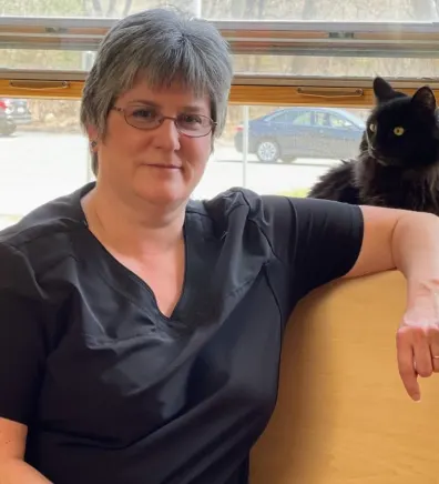 Lynette with a black cat