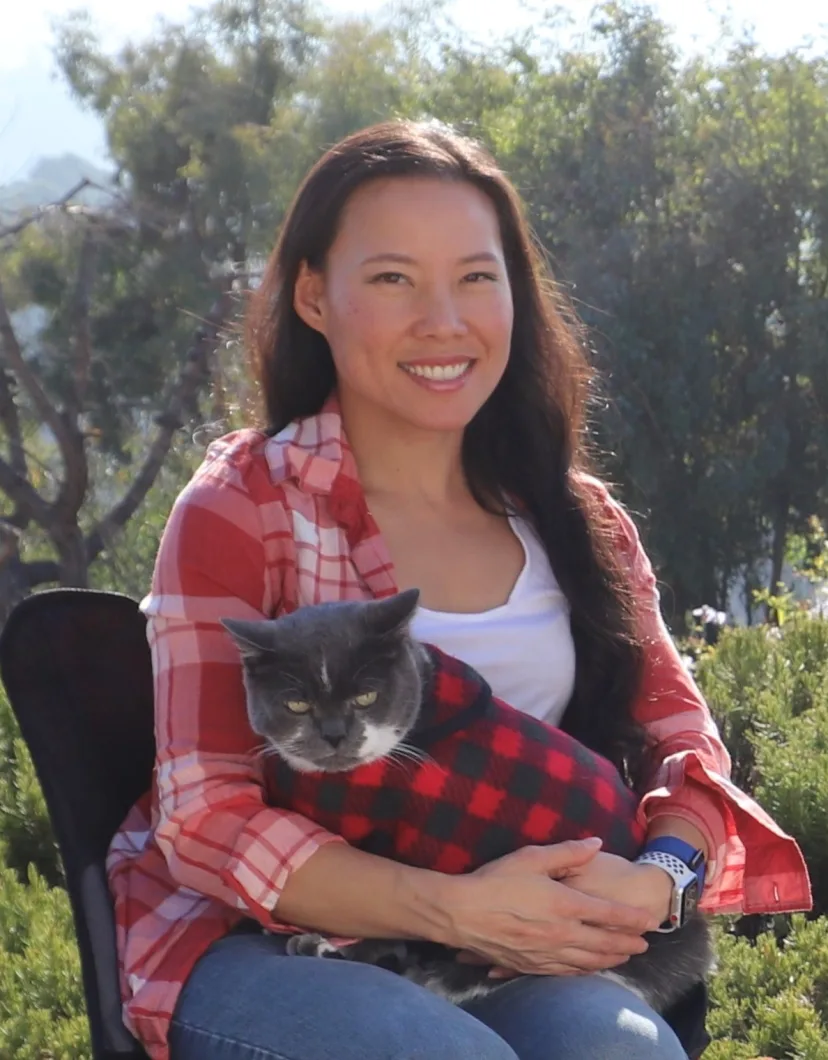 Laura Chan outside with grey cat