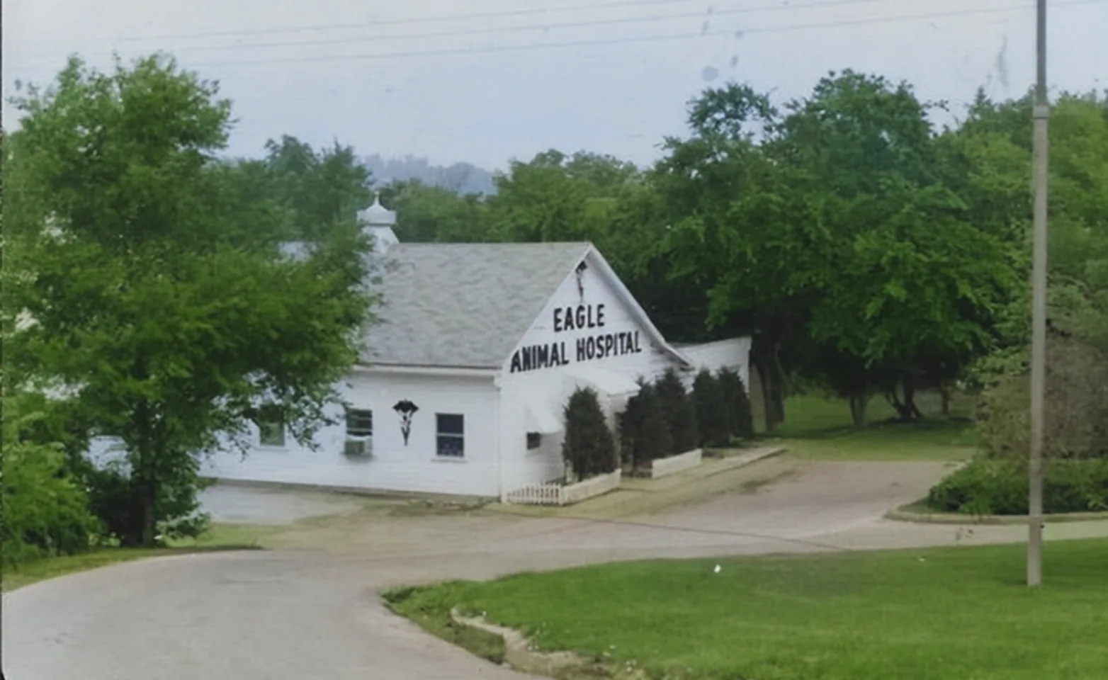 A picture of Eagle Animal Hospital at its founding and Dr. Tom Eagle A picture of Eagle Animal Hospital at its founding and Dr. Tom Eagle