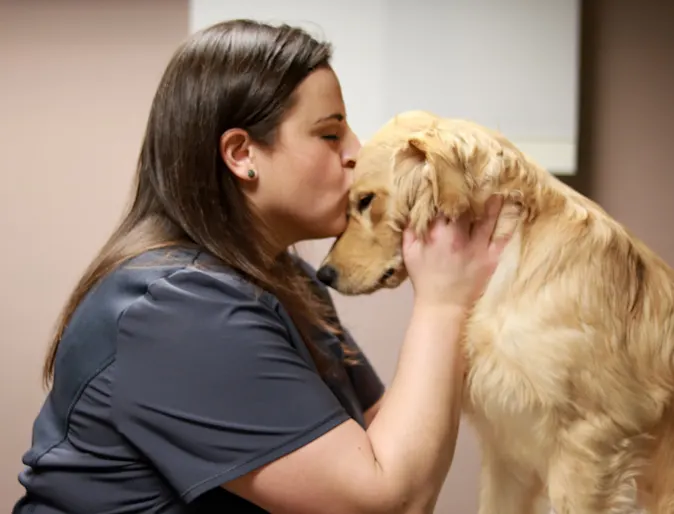 Vet Tech kissing dog Vet Tech kissing dog