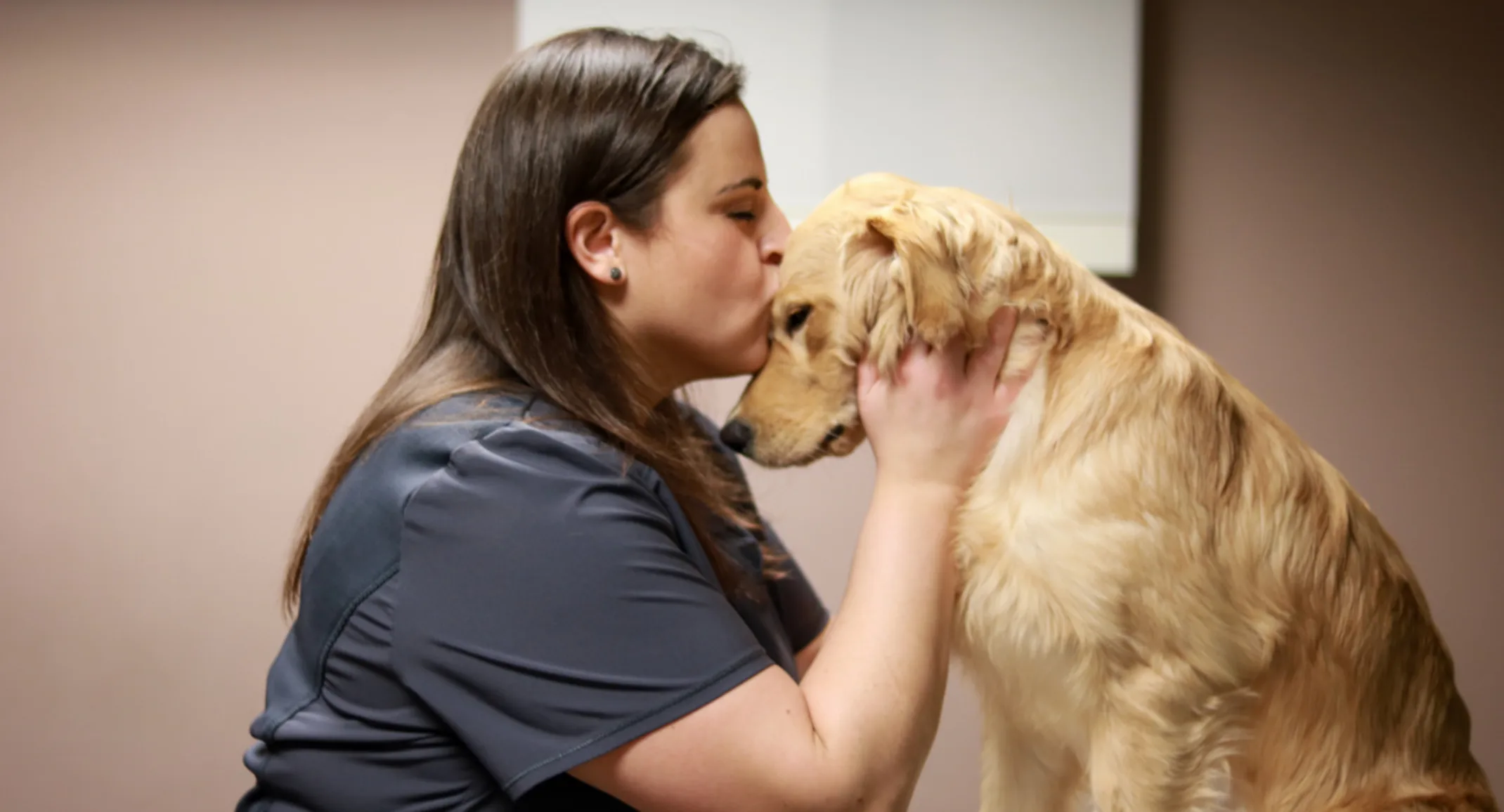 Vet Tech kissing dog Vet Tech kissing dog