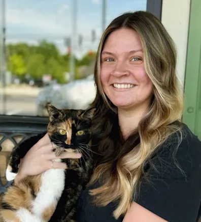Hailey Sparks with a calico cat Hailey Sparks with a calico cat