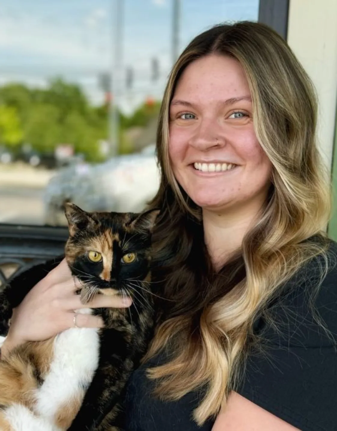 Hailey Sparks with a calico cat Hailey Sparks with a calico cat