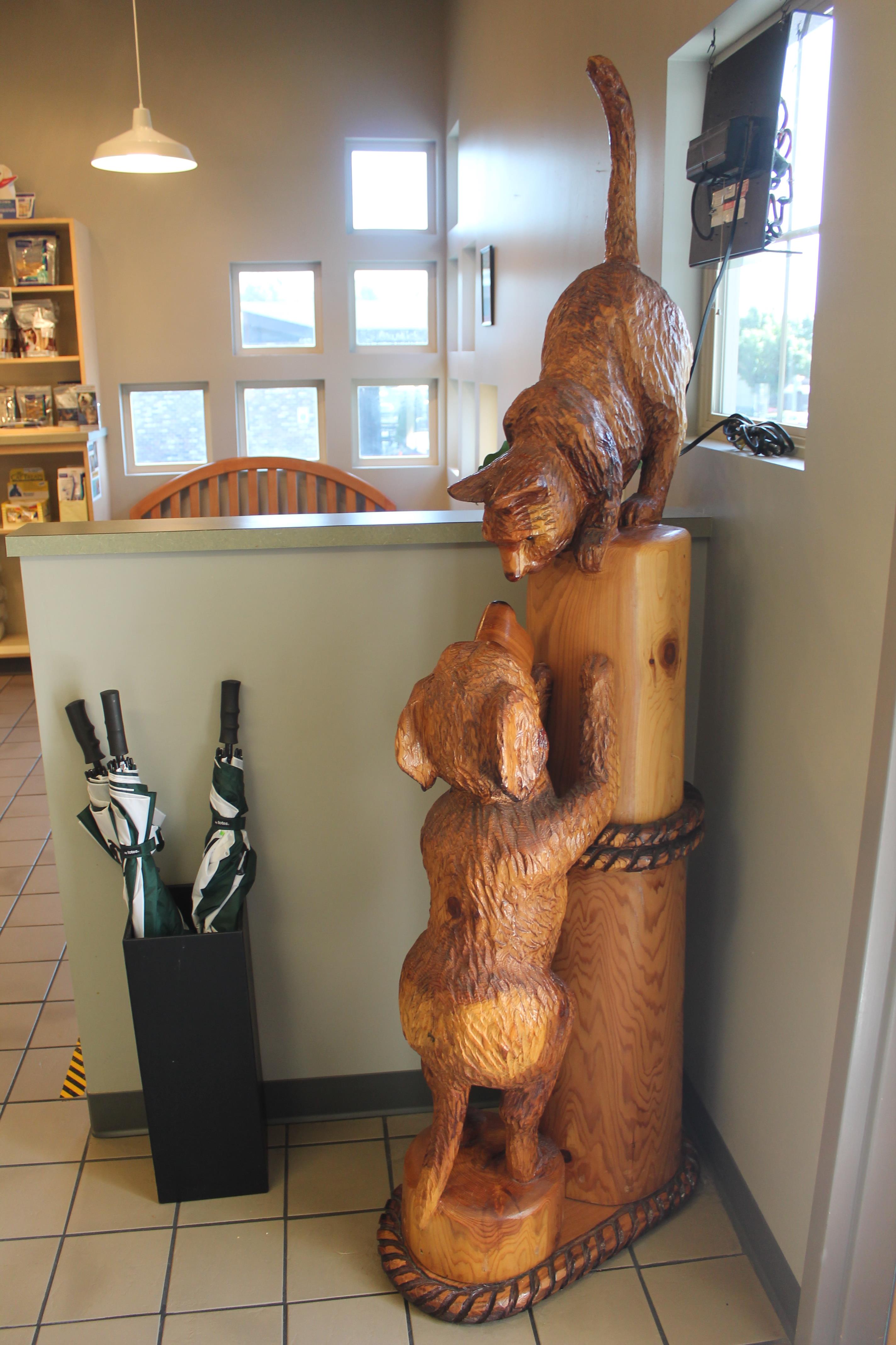 Cat and dog wooden statue