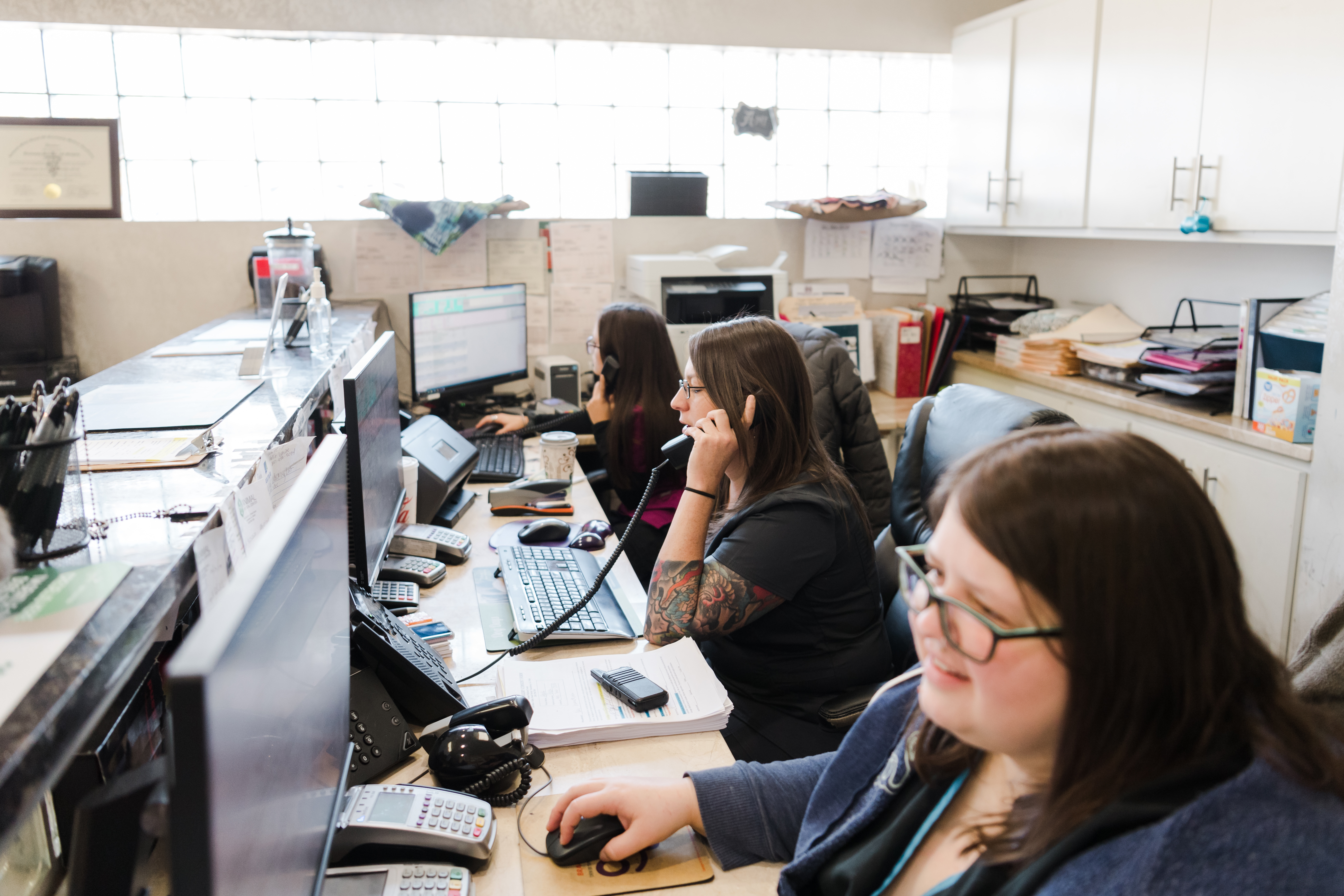 FRONT OFFICE STAFF ANSWERING THE PHONE