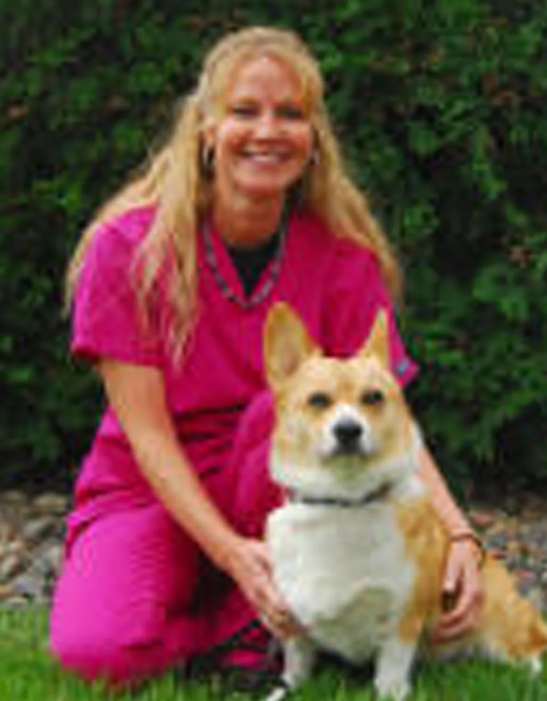 Cindy's staff photo from Stillwater Veterinary Clinic with her Corgi dog posing with her for a photo Cindy's staff photo from Stillwater Veterinary Clinic with her Corgi dog posing with her for a photo