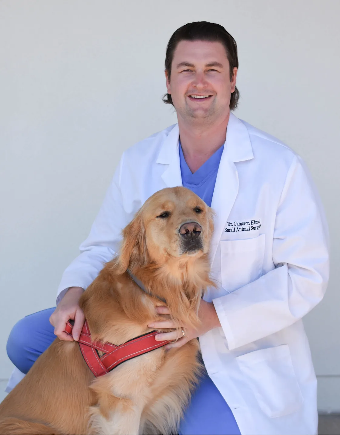 Cameron Himel and a Golden Retriever Cameron Himel and a Golden Retriever