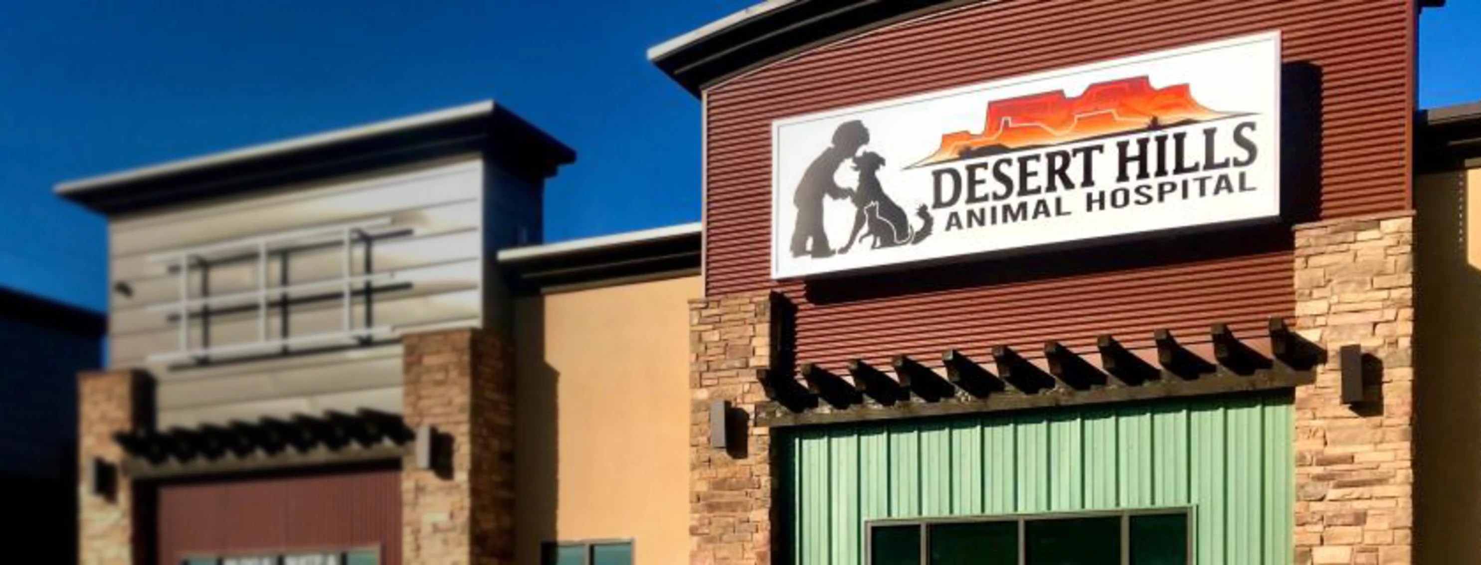 Exterior photo of Desert Hills Animal Hospital and front signage