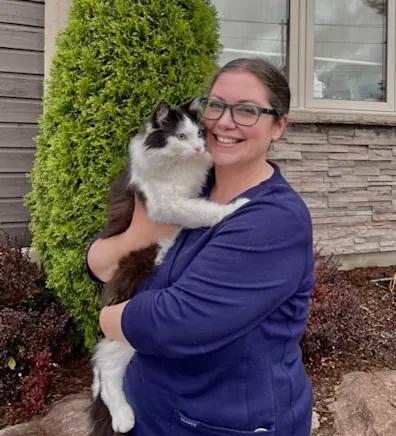 Amber holding her three cats Amber holding her three cats