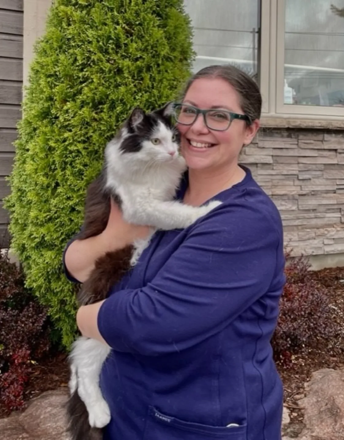 Amber holding her three cats Amber holding her three cats