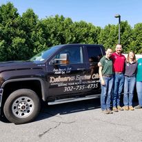 Doctor group pic in front of truck