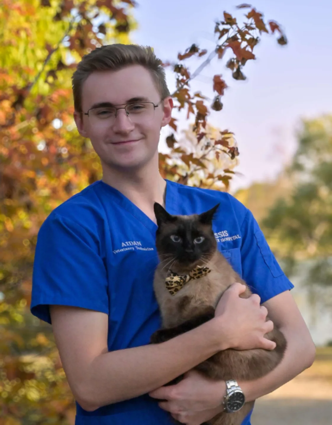 Aidan holding a cat with a tie Aidan holding a cat with a tie