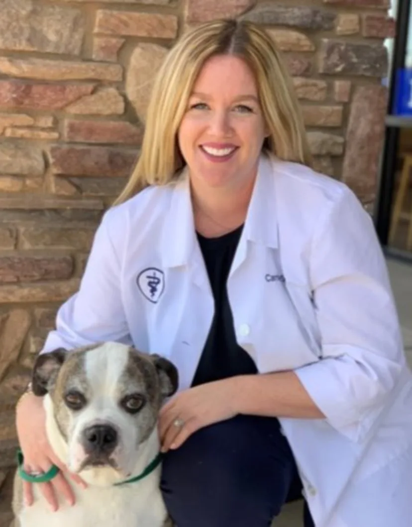  Dr. Carrie Sander - DVM with white dog