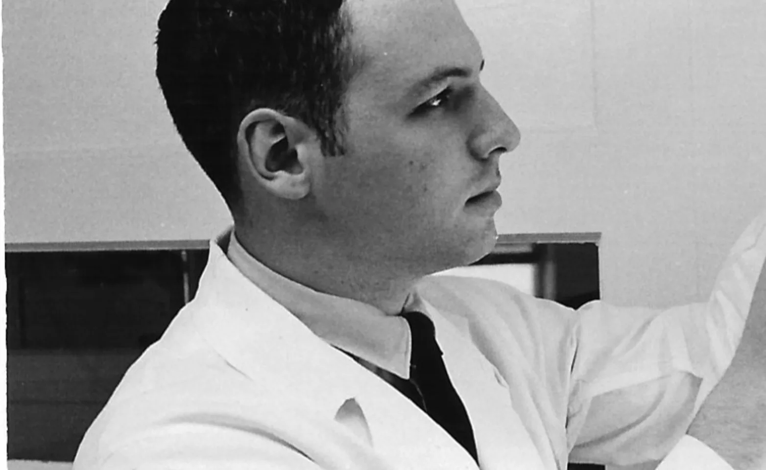 man in lab coat looking off camera man in lab coat looking off camera