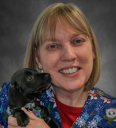 Jill Meunier posing with a Yorkie Jill Meunier posing with a Yorkie