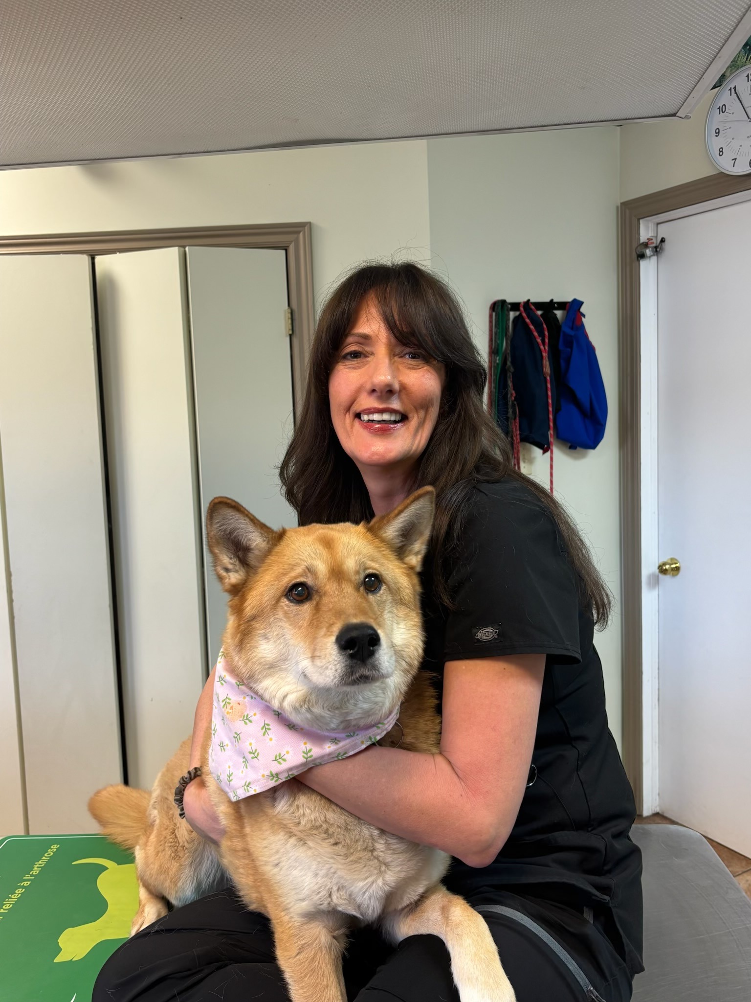 Kim of Three Islands Veterinary Clinic standing in the front office of the hospital