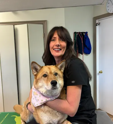 Kim of Three Islands Veterinary Clinic standing in the front office of the hospital Kim of Three Islands Veterinary Clinic standing in the front office of the hospital