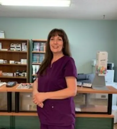 Kim of Three Islands Veterinary Clinic standing in the front office of the hospital
