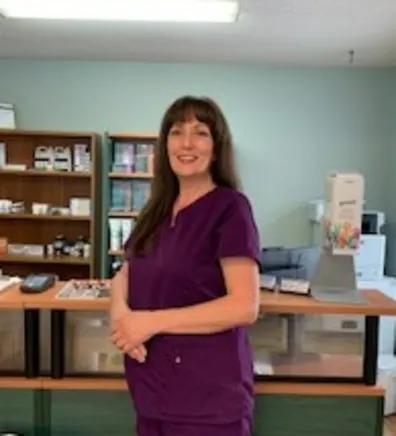 Kim of Three Islands Veterinary Clinic standing in the front office of the hospital Kim of Three Islands Veterinary Clinic standing in the front office of the hospital