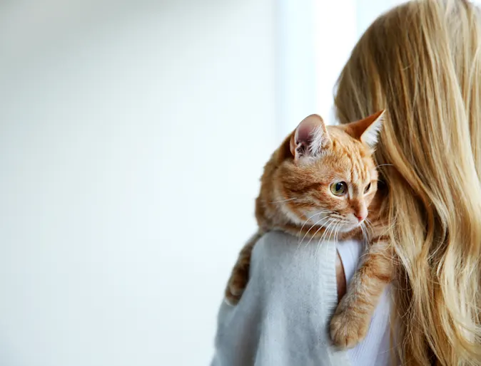 Woman holding cat