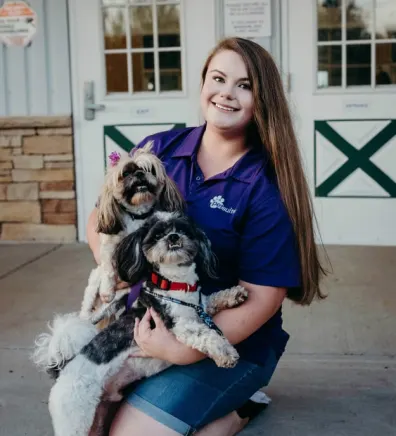 PetSuites General Manager Brittney Smith with her two shih tzus.