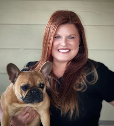 Lindsey Yeary holding a brown pug Lindsey Yeary holding a brown pug