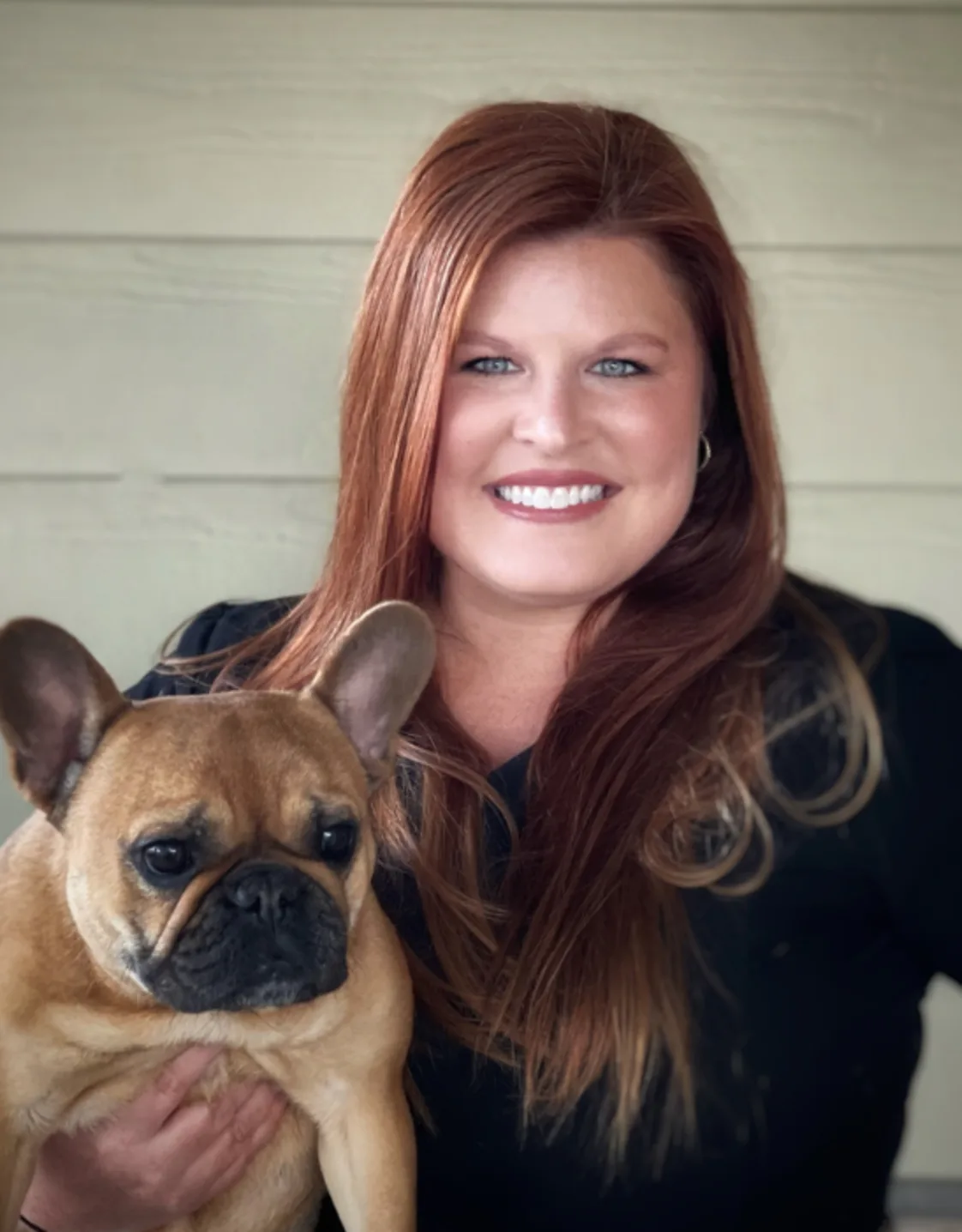 Lindsey Yeary holding a brown pug Lindsey Yeary holding a brown pug