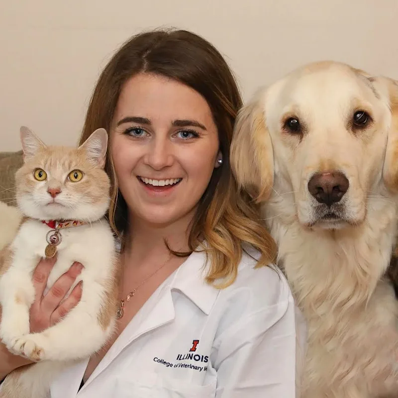 Dr. Torrey Schwartz sitting with a dog and cat Dr. Torrey Schwartz sitting with a dog and cat