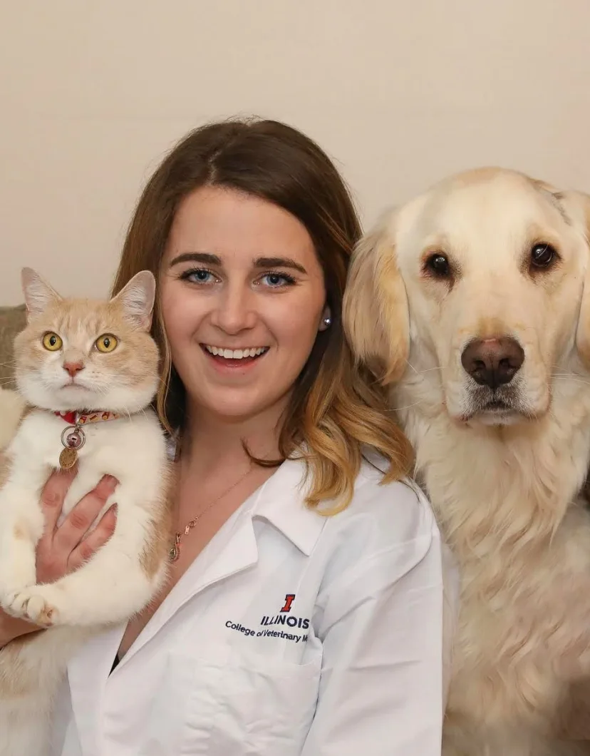 Dr. Torrey Schwartz sitting with a dog and cat