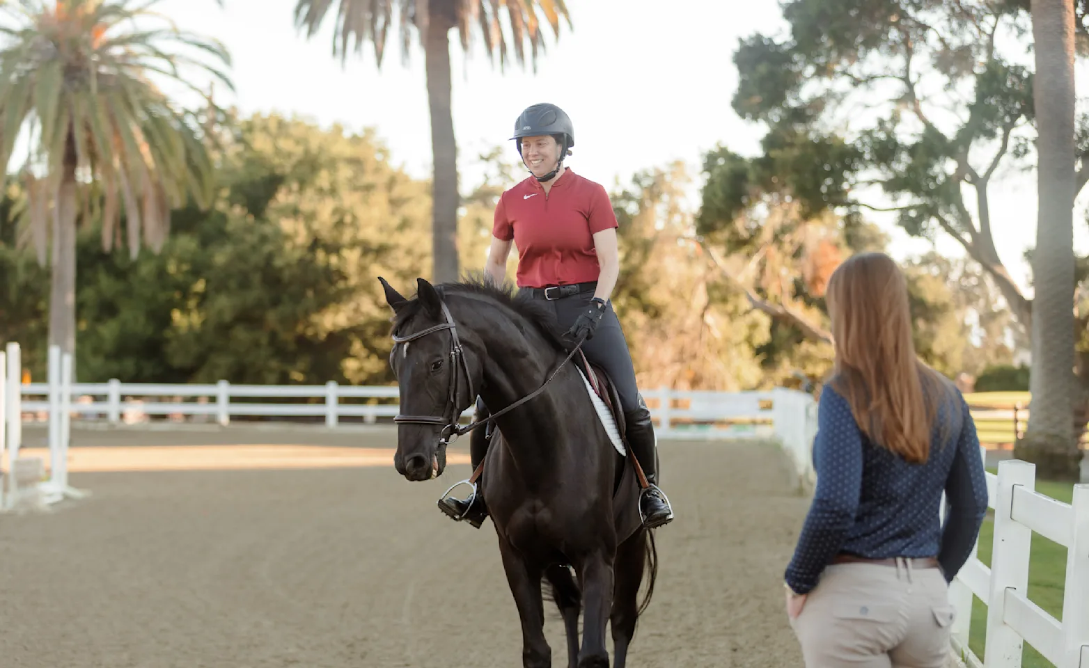 Veterinarian watching client ride her horse Veterinarian watching client ride her horse