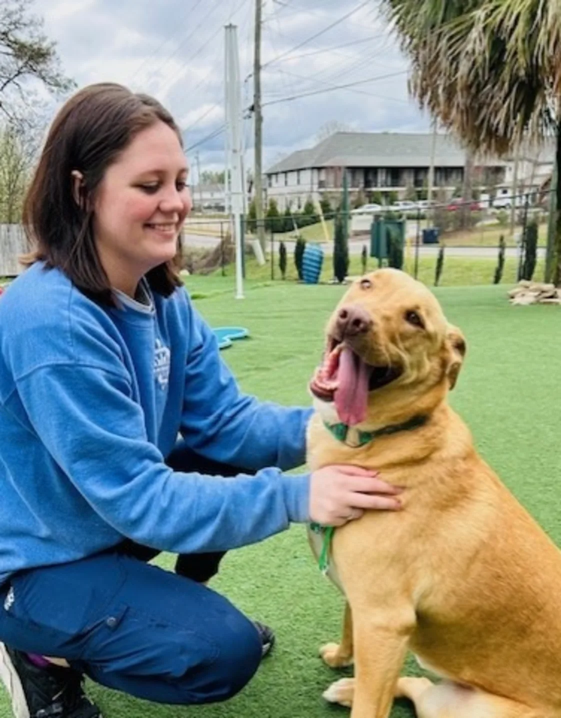 Amberlee smiling and holding a white and orange cat Amberlee smiling and holding a white and orange cat