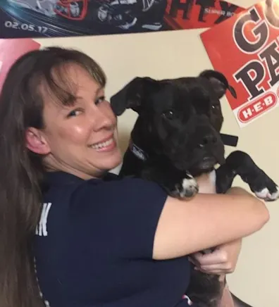 Rachael holding onto a pitbull mix. Rachael holding onto a pitbull mix.
