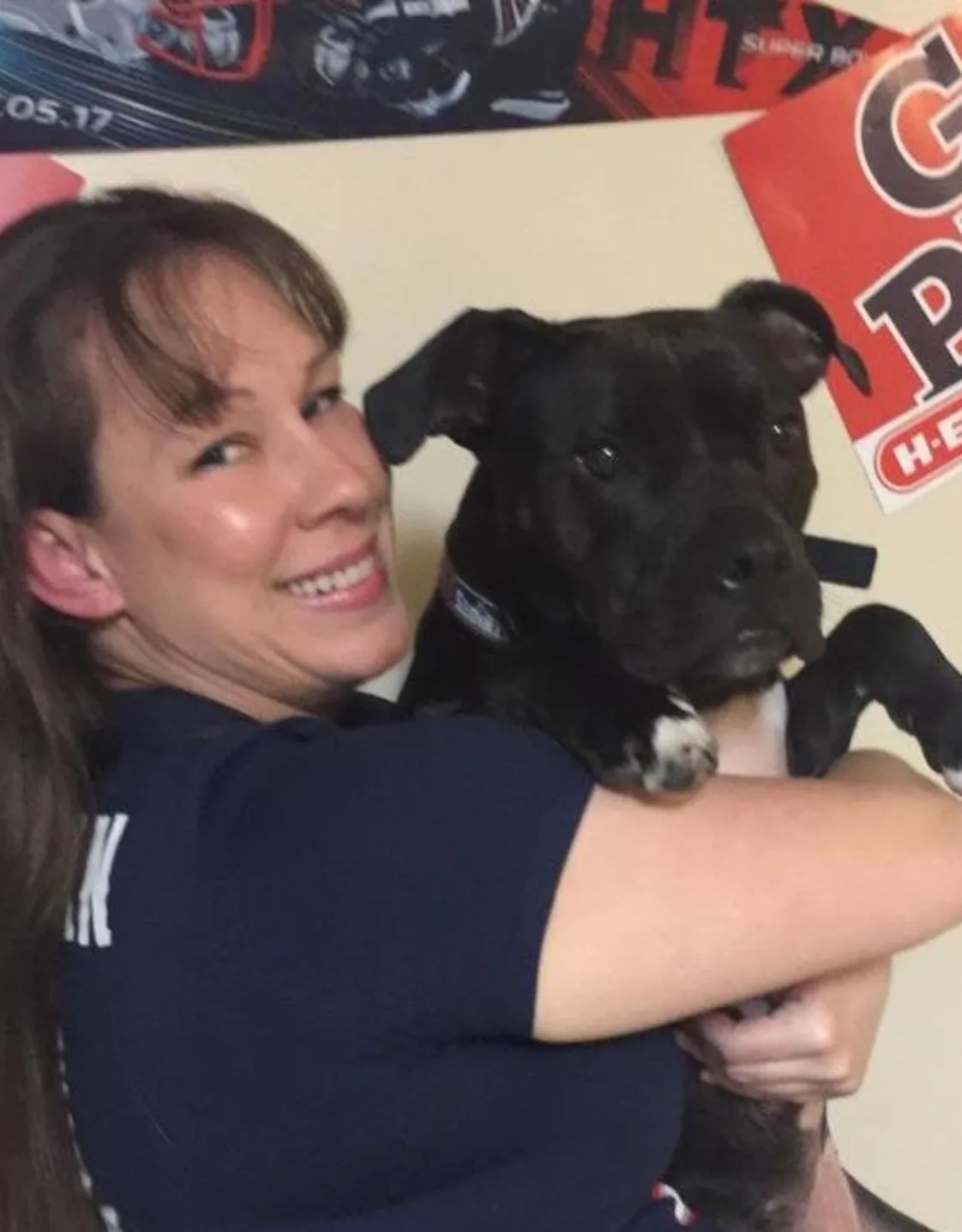 Rachael holding onto a pitbull mix. Rachael holding onto a pitbull mix.