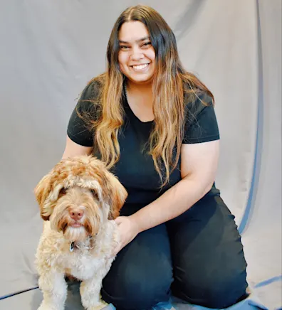 Valeria sitting with a dog Valeria sitting with a dog